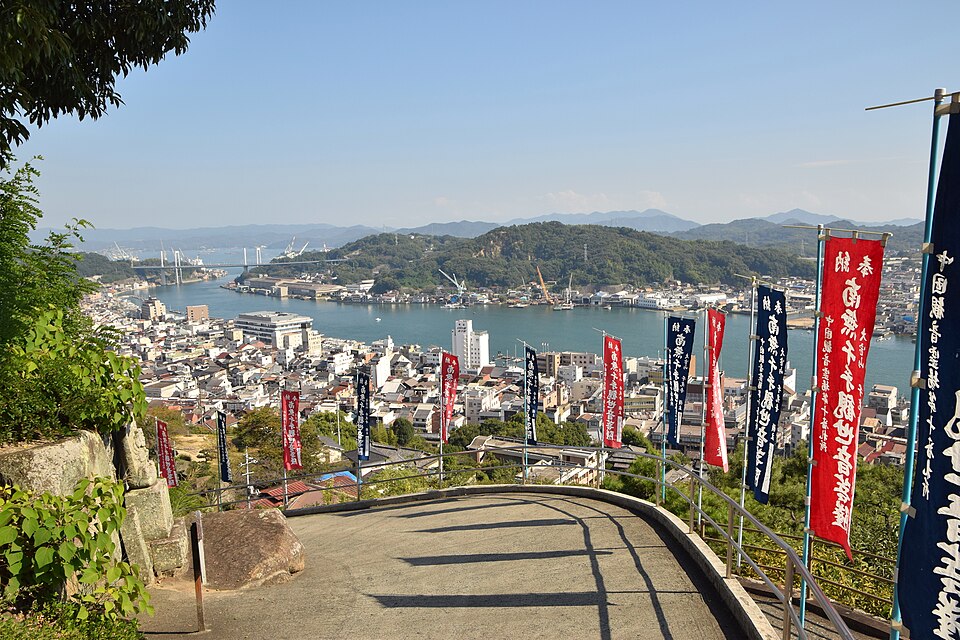 View from the hillside across Onomichi town and the blue channel toward Mukaishima