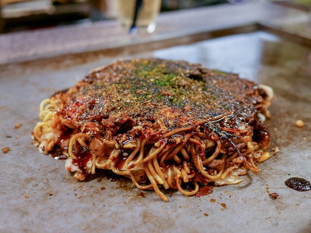 Okonomiyaki with noodles at Okonomiyaki Yoshino