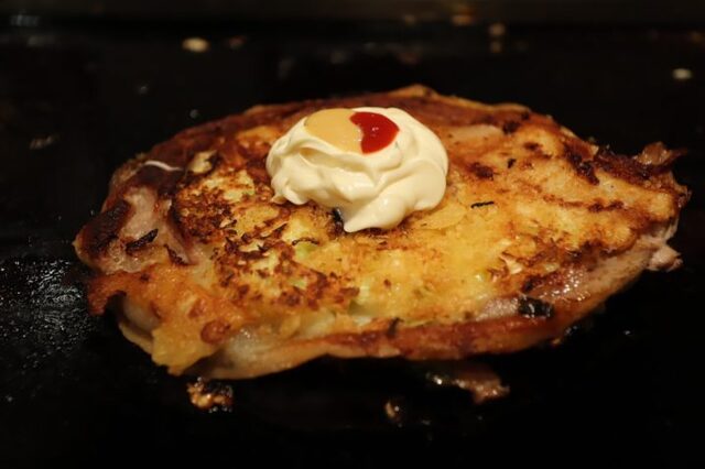 Golden okonomiyaki topped with mayonnaise at Zouya