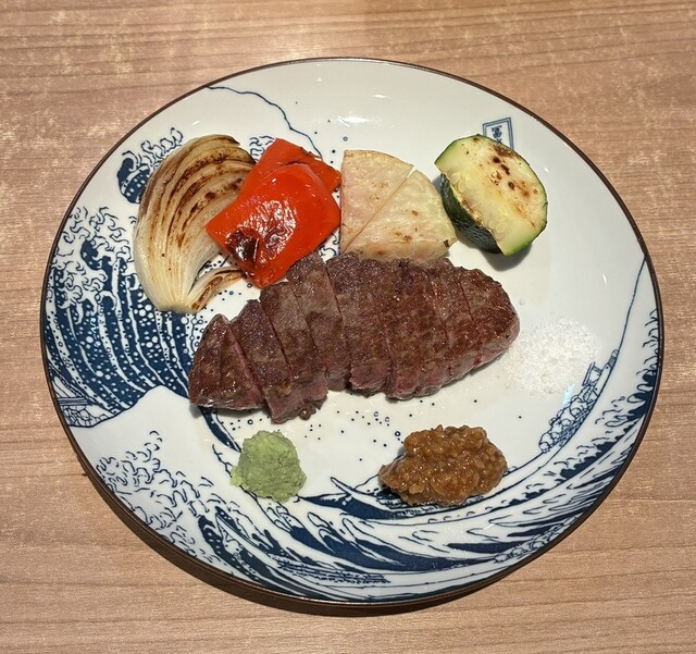 Steak served with grilled vegetables at Taku - Fushimi