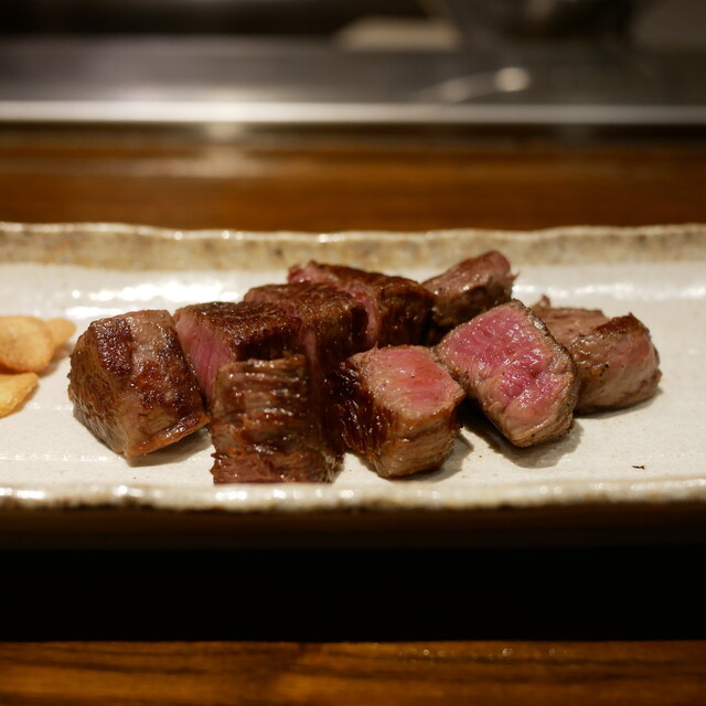 Sliced steak on a rectangular plate at Ranma - Azabu
