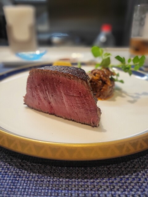 Steak served on a plate at Onomichi
