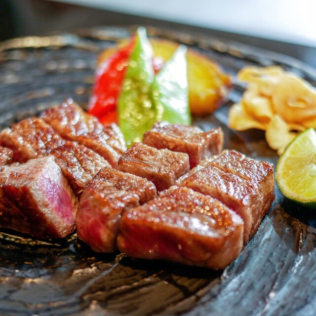 Sliced grilled steak with vegetables at Kura Teppanyaki and Sushi